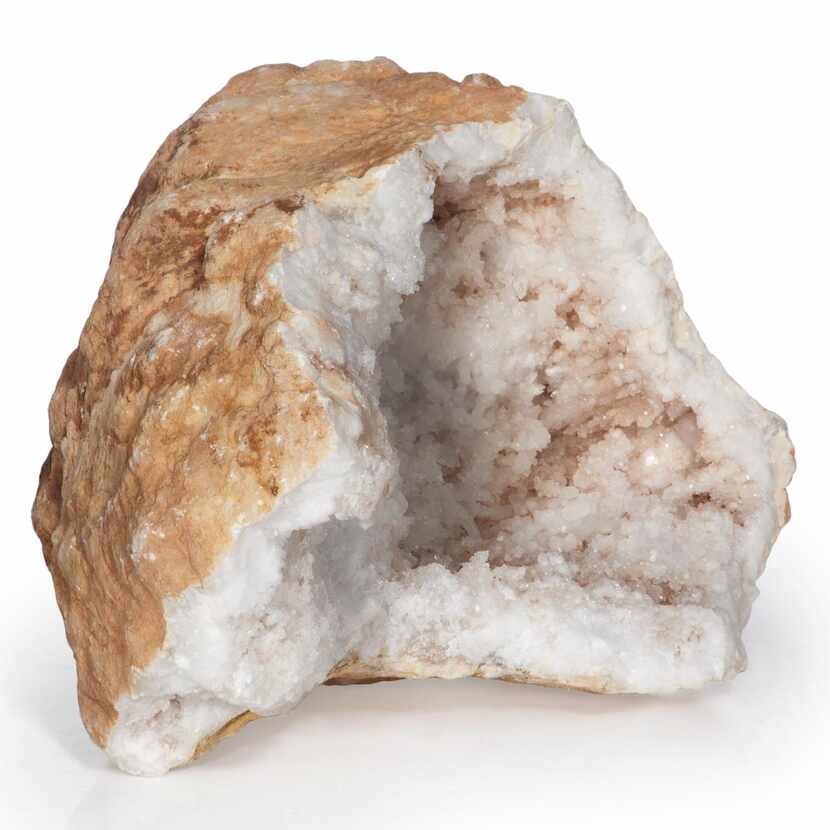 
The rough exterior of this calcite geode is a stark contrast to the bright crystal...