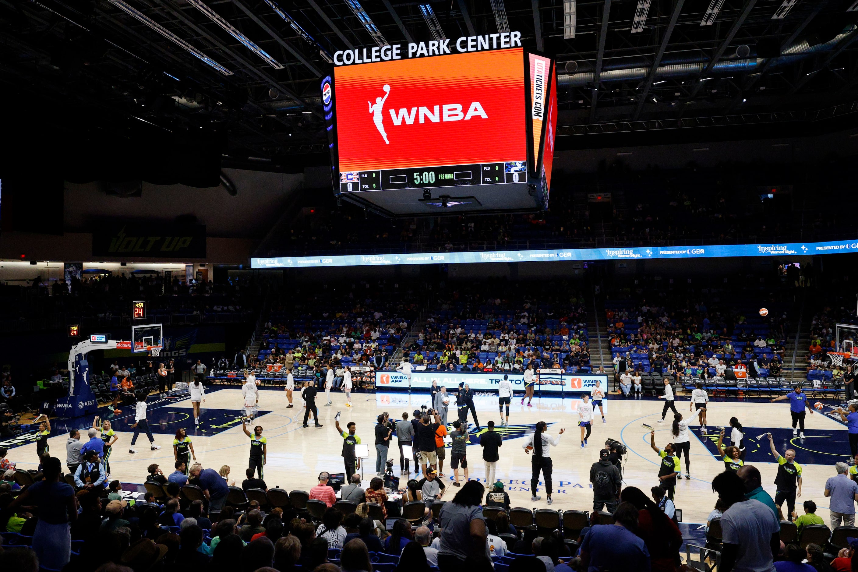 Players warm up before a WNBA basketball game between the Dallas Wings and the Connecticut...