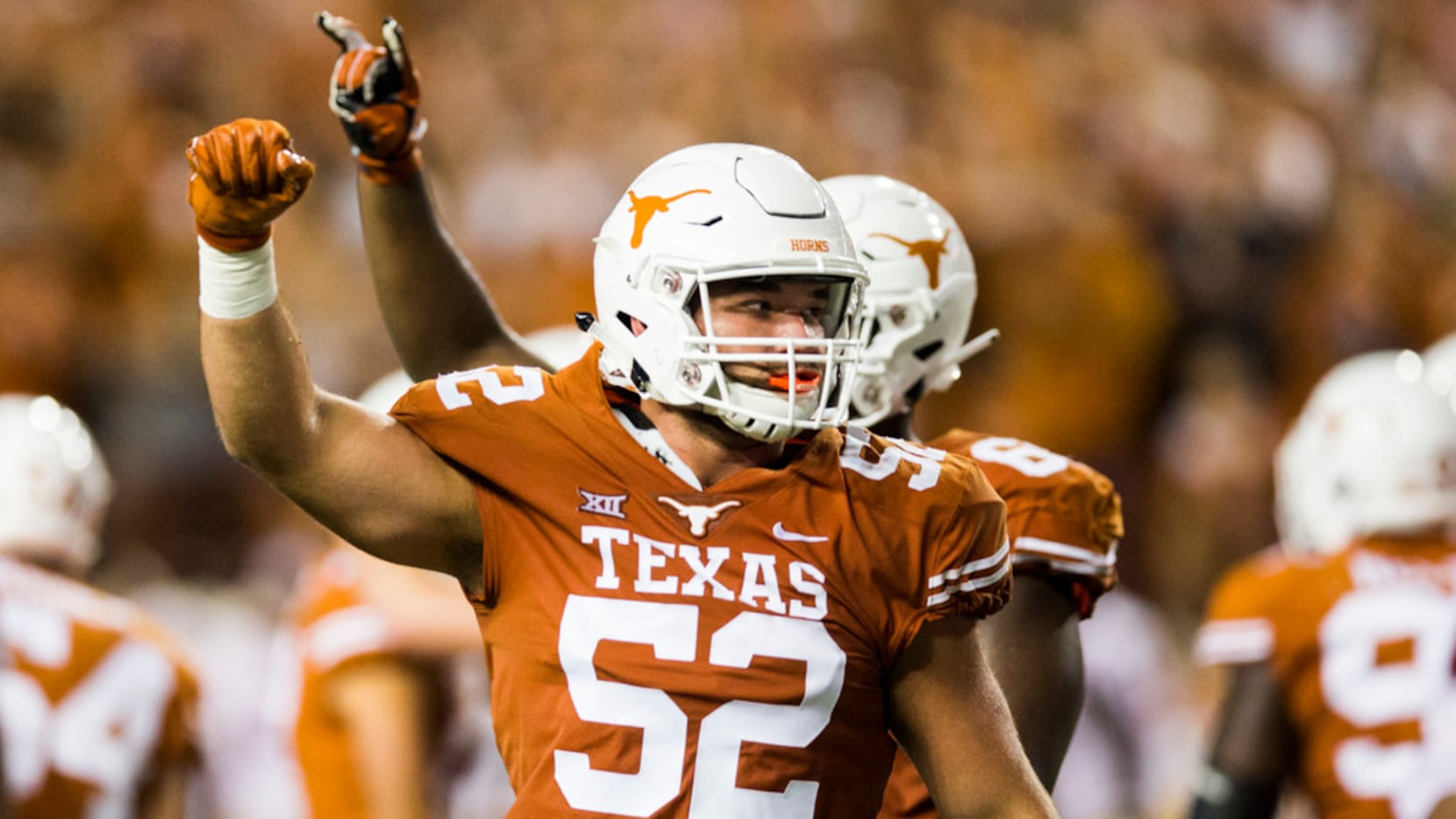FILE - Texas offensive lineman Samuel Cosmi (52) celebrates a field goal at the end of the...