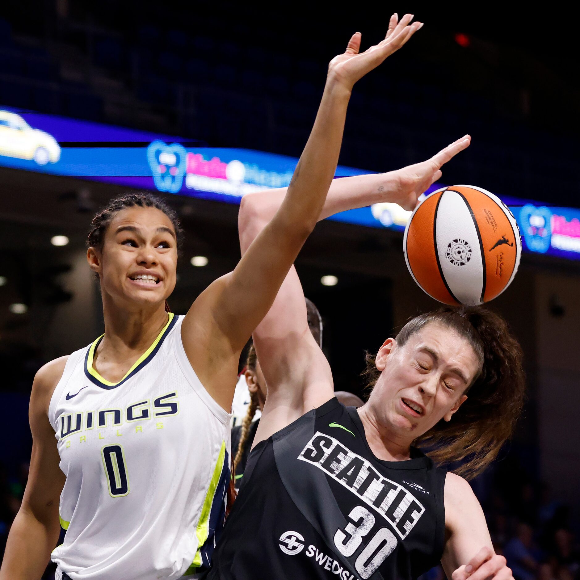 Dallas Wings forward Satou Sabally (0) battles Seattle Storm forward Breanna Stewart (30)...