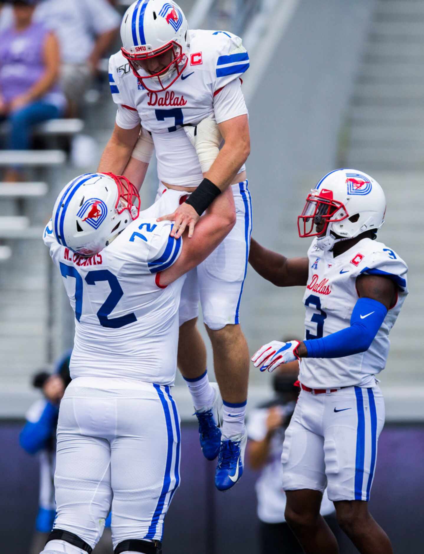 Southern Methodist Mustangs quarterback Shane Buechele (7) celebrates in the end zone with...