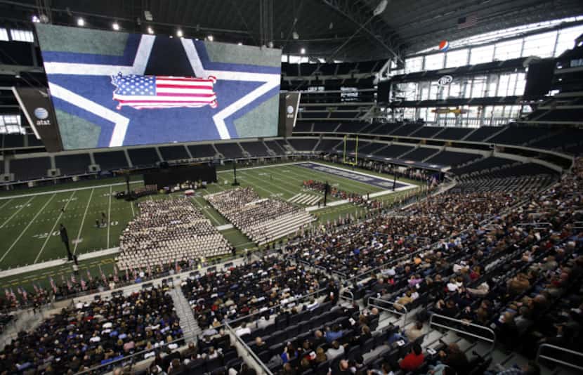 Chris Kyle's casket rests on the Cowboys star on the 50-yard-line at Cowboys Stadium during...