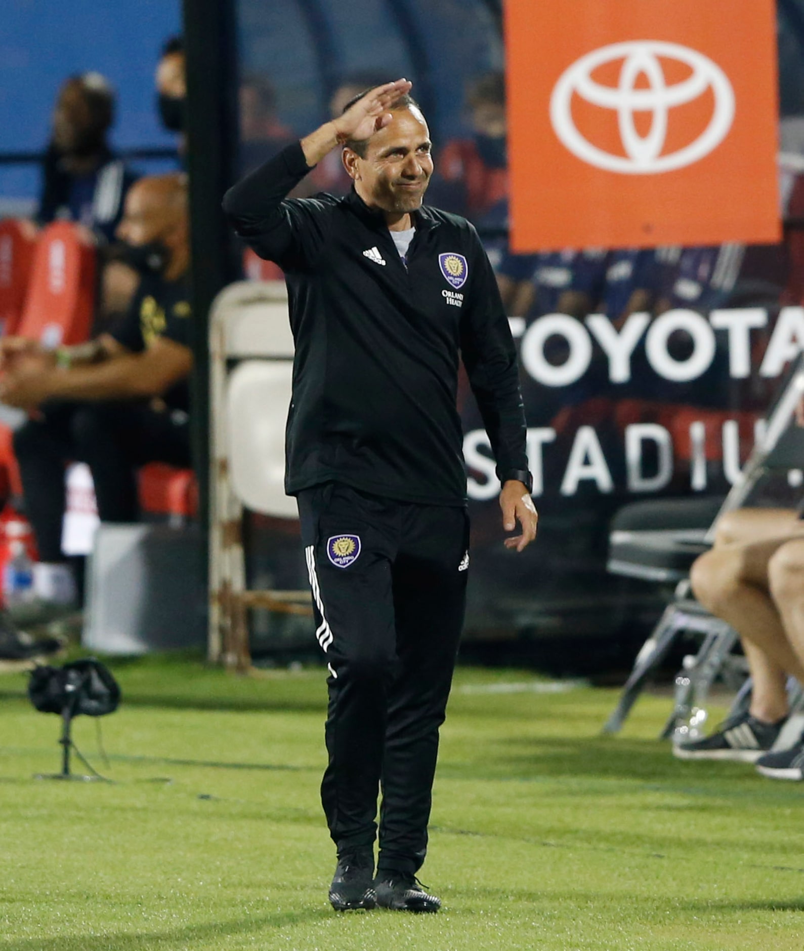 Orlando City head coach Oscar Pareja waves to the crowd before playing FC Dallas at Toyota...