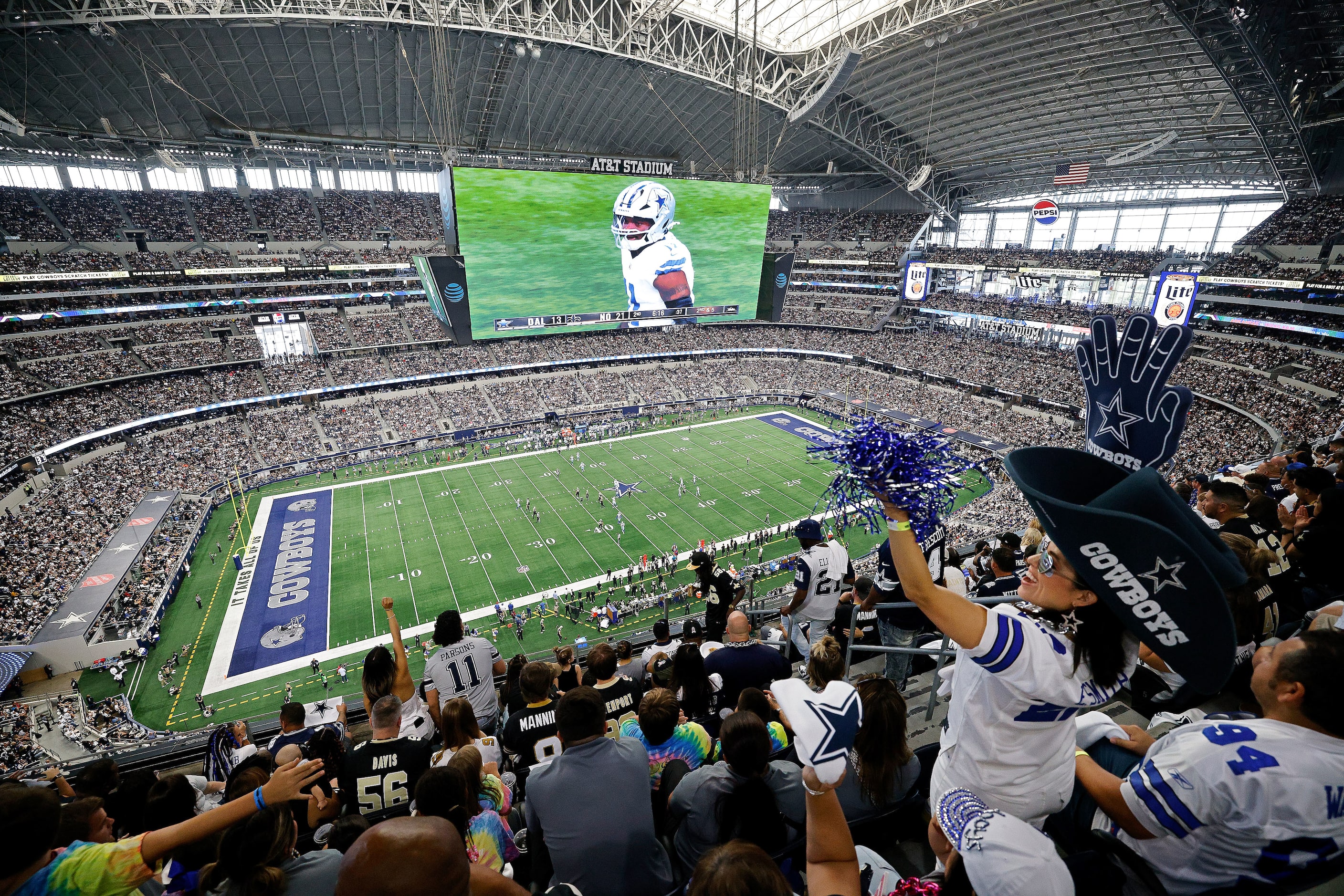 Dallas Cowboys fan Tanni Diaz of Laredo, Texas, cheers during the first half of an NFL...