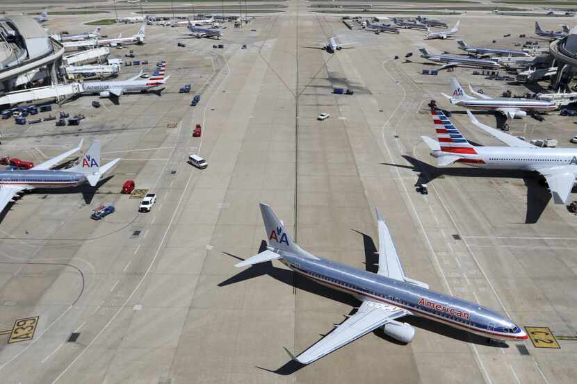 American Airlines planes on on terminals A and C are seen from on top of the American...