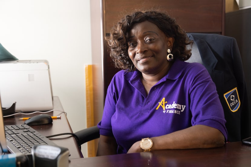 Finance teacher Rita Jones poses for a photo in her office following a balloon release for...