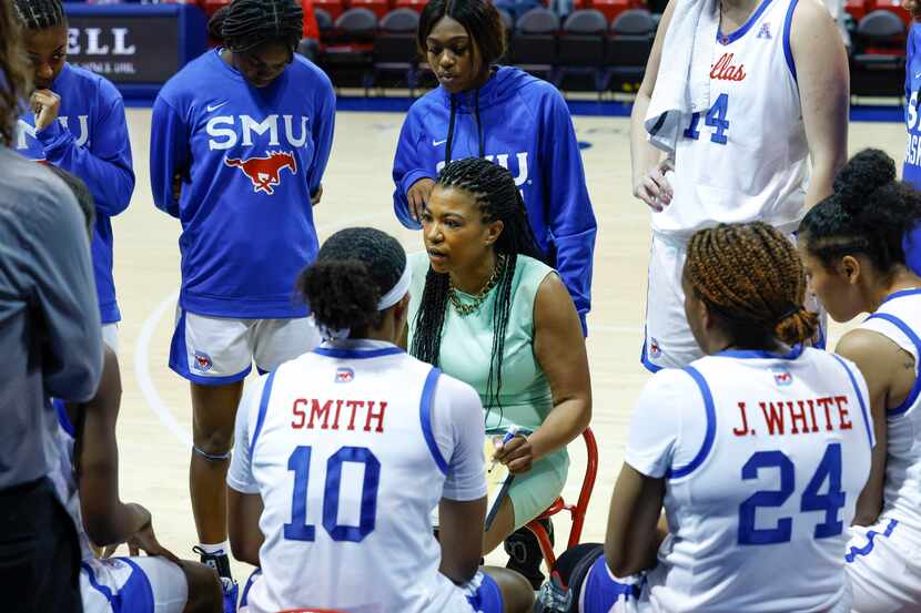 SMU head coach Toyelle Wilson talks with the team during a timeout in the third quarter of a...