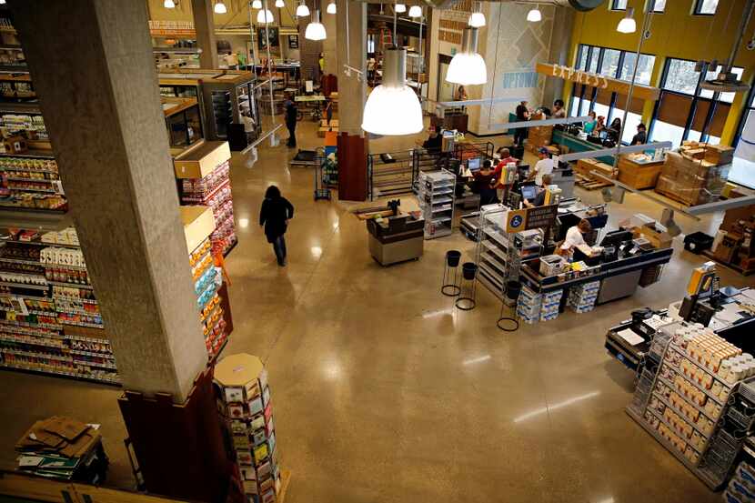  Employees work to set up the new Whole Foods Market Wednesday, August 5, 2015 in Uptown...