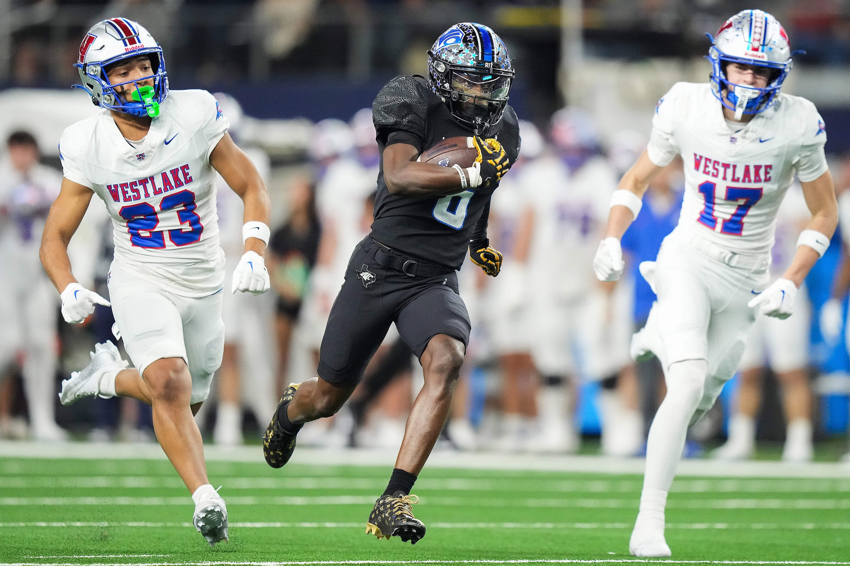 North Crowley wide receiver Quentin Gibson (6) races past Austin Westlake defensive backs...