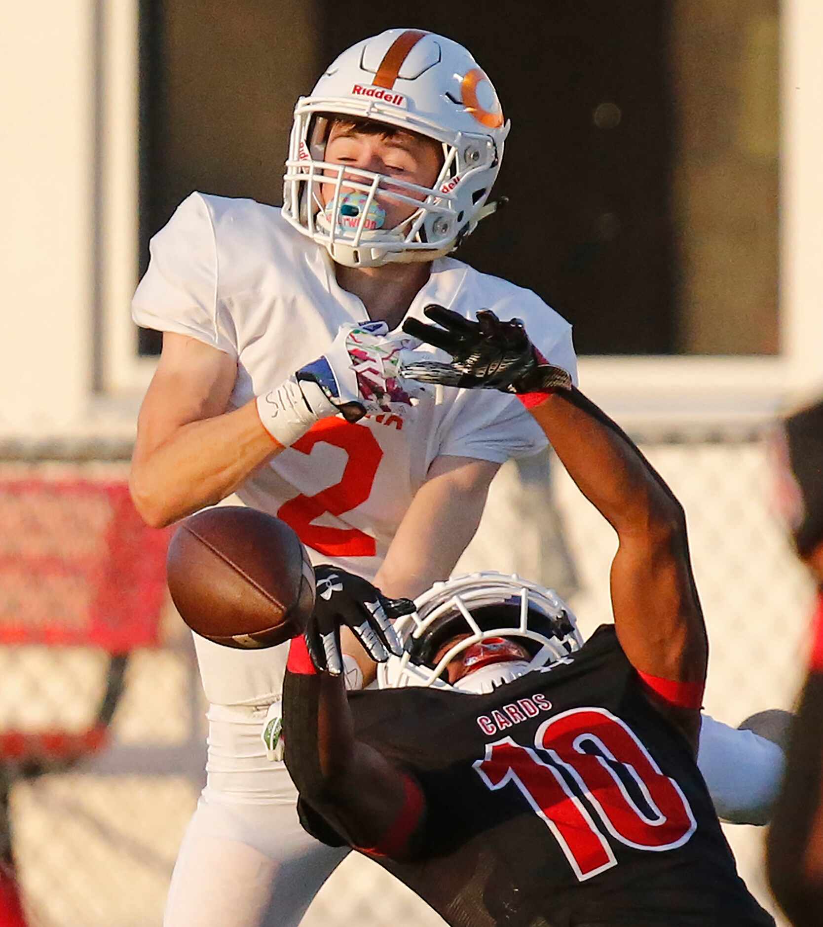 Melissa High School Parrish Adger (10) breaks up a pass intended for Celina High School wide...