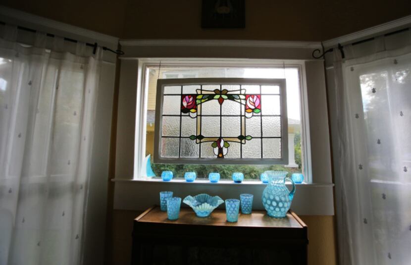 A stained glass window in the dining room at Jackie and Doug Sweat's home on Junius Street...
