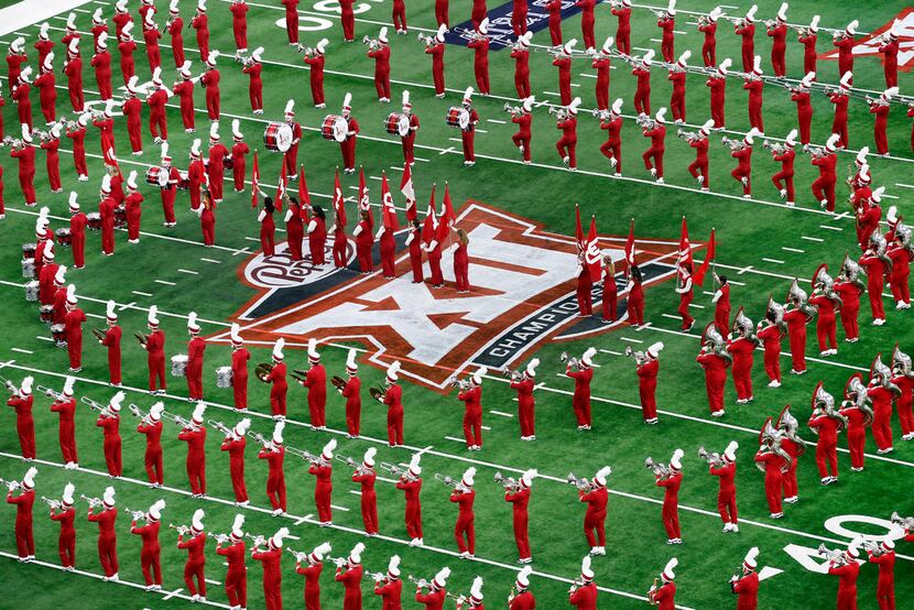 The Oklahoma Sooners marching band performs before the Big 12 Championship at AT&T Stadium...