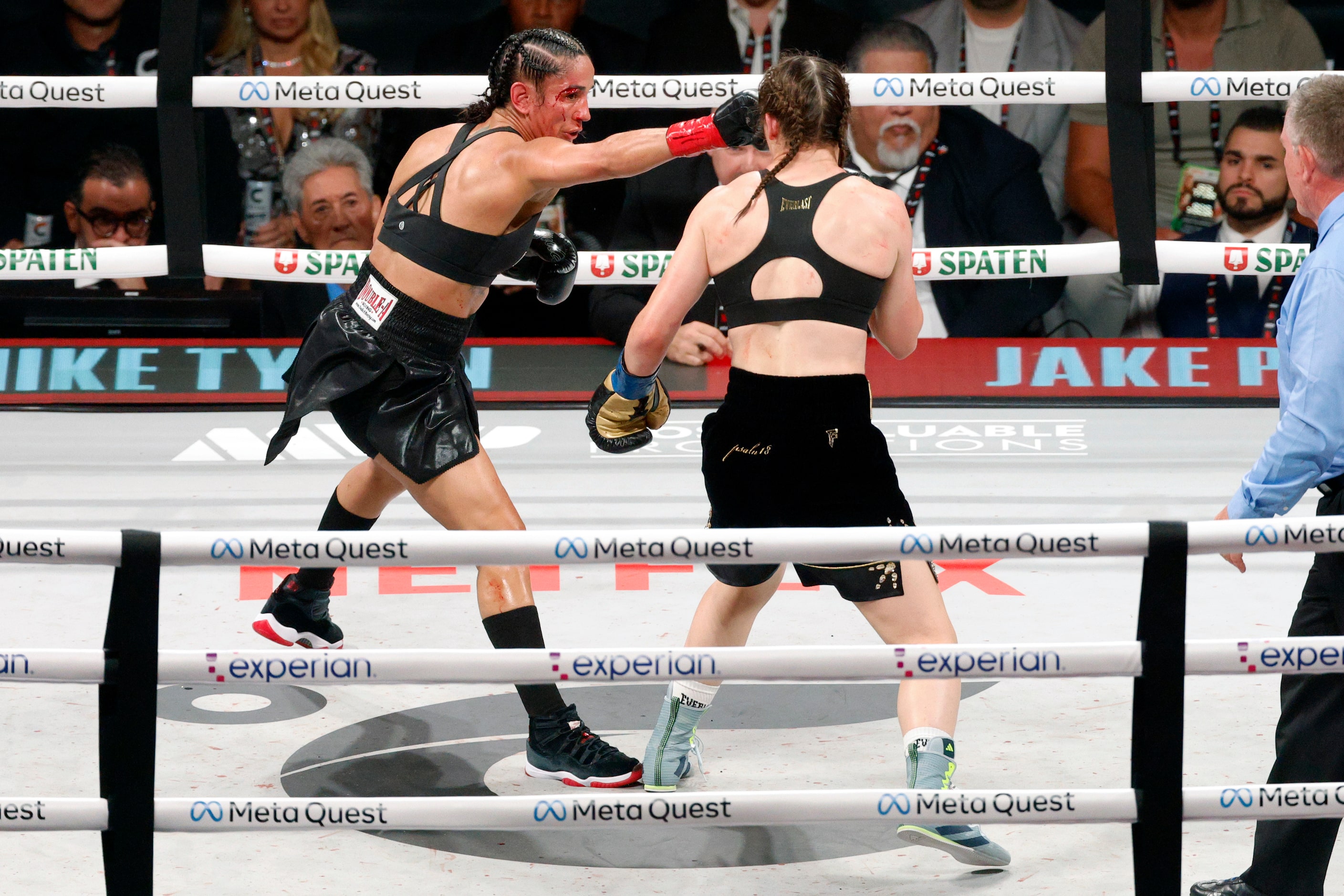 Amanda Serrano hits Katie Taylor during round eight of the undisputed super lightweight...