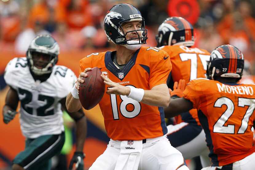 Denver Broncos quarterback Peyton Manning (18) prepares to pass during the third quarter...