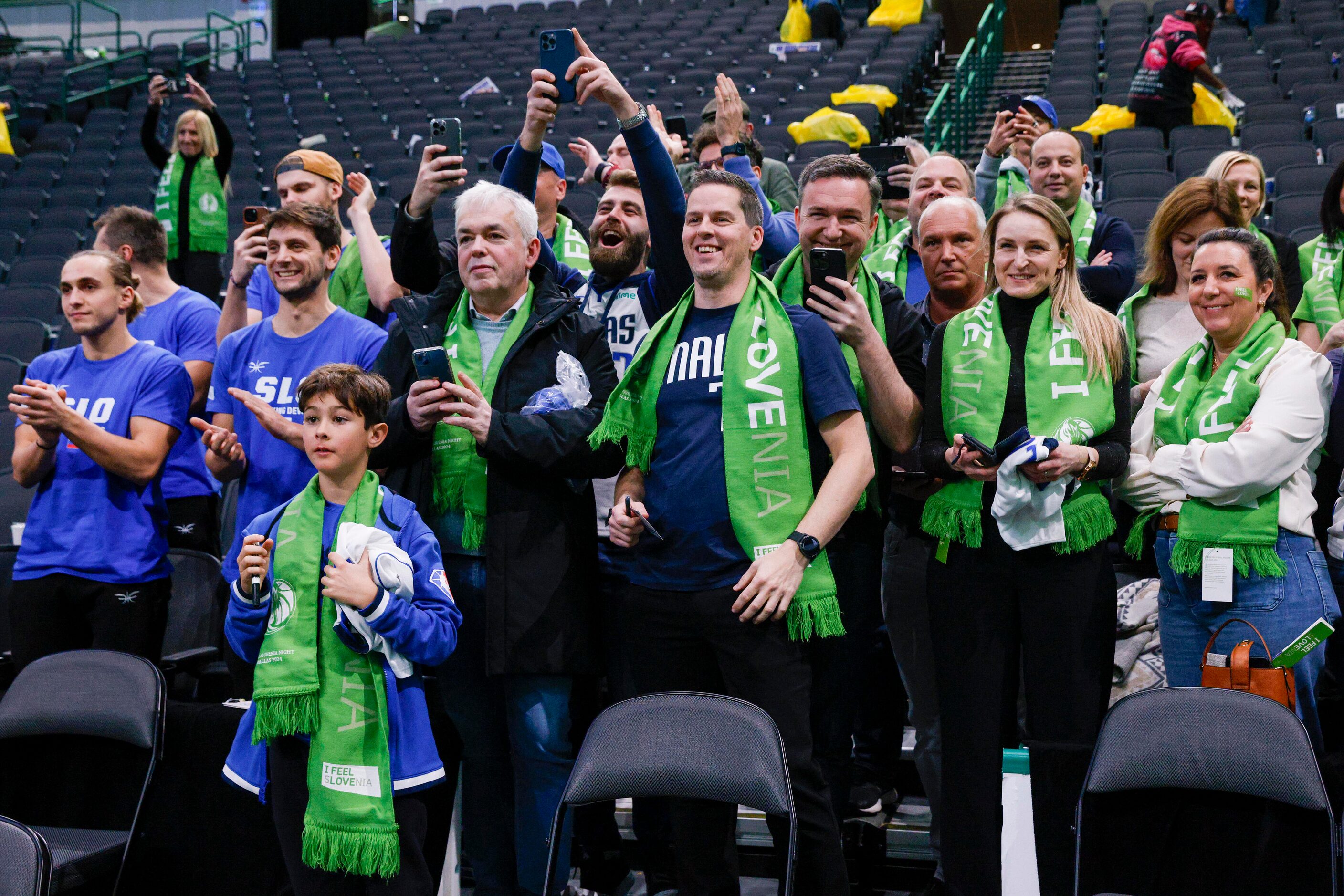 Slovenian fans cheer as they meet Dallas Mavericks guard Luka Doncic after an NBA game,...