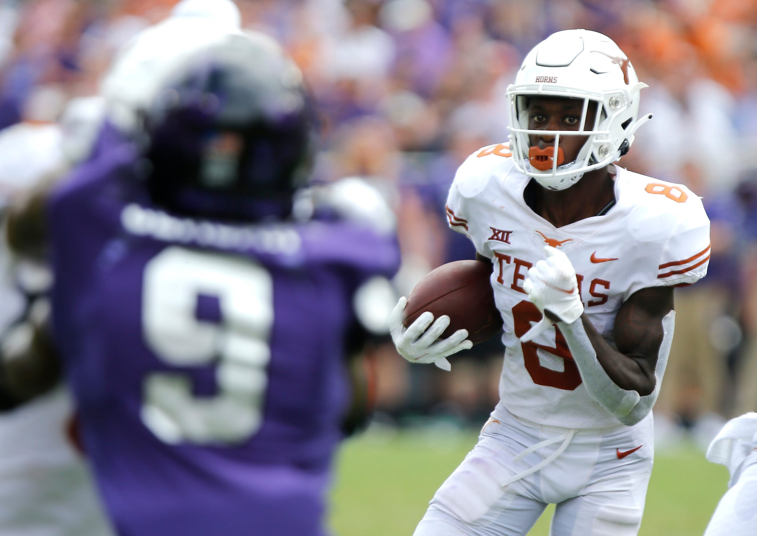 Texas Longhorns wide receiver Xavier Worthy (8) runs the ball on a reverse during the second...