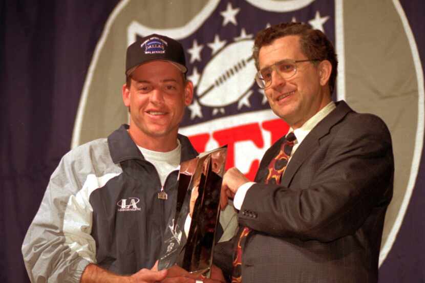 Dallas Cowboys quarterback Troy Aikman, left, receives the Super Bowl MVP trophy from Paul...