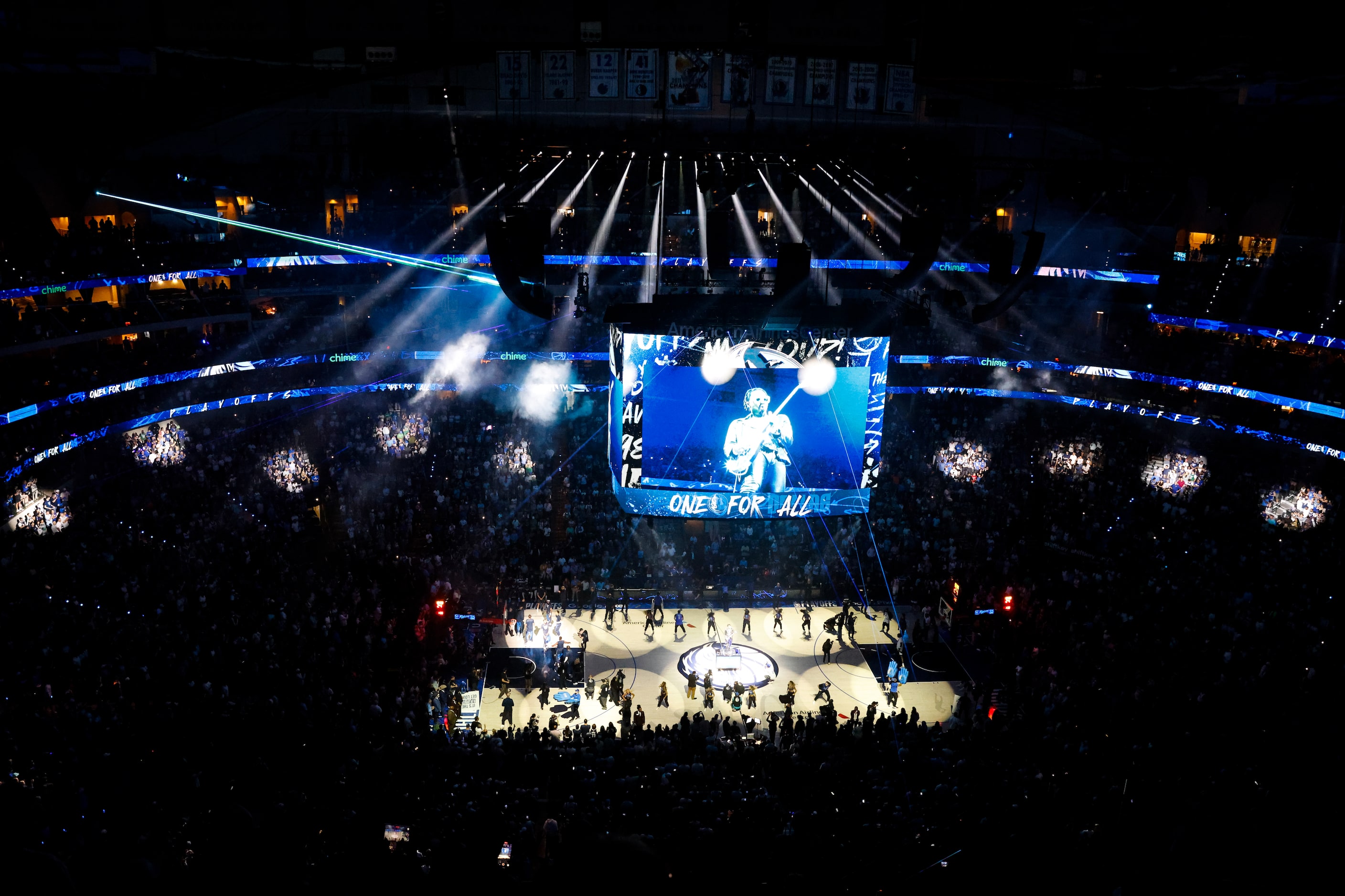 Guitarist Justin Lyons plays during player introductions in Game 4 of the Western Conference...