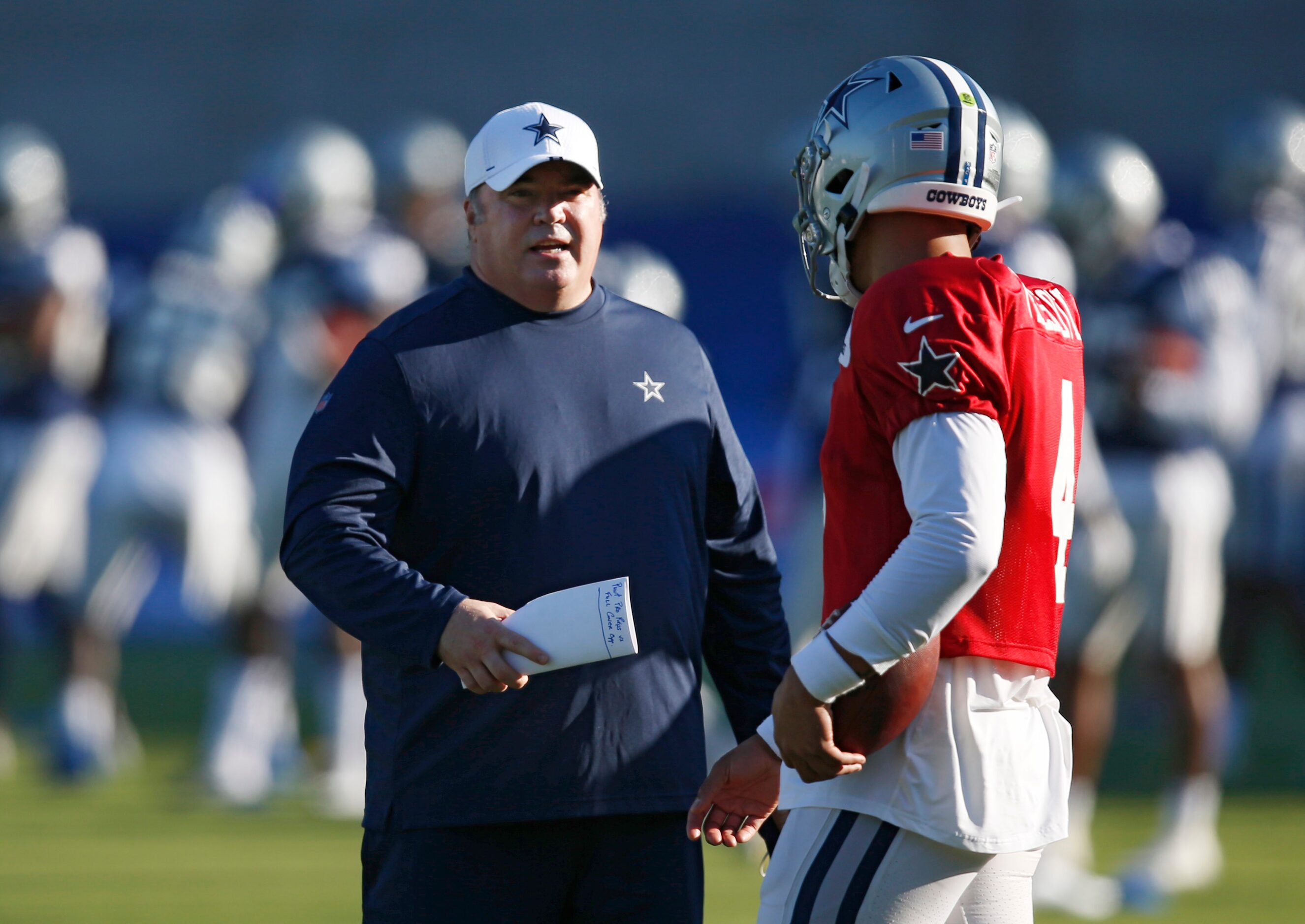 Dallas Cowboys head coach Mike McCarthy talks with Dallas Cowboys quarterback Dak Prescott...