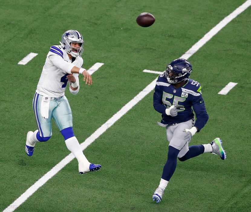 Dallas Cowboys quarterback Dak Prescott (4) throws the ball as Seattle Seahawks defensive...