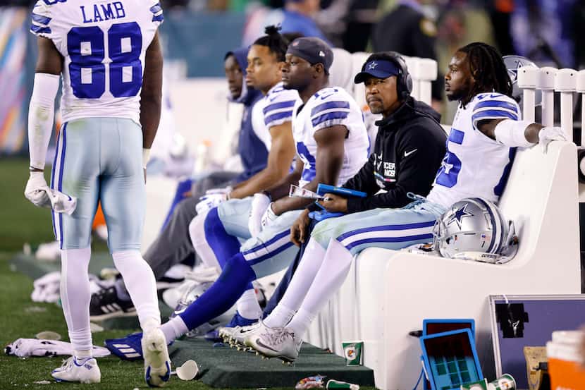 Dallas Cowboys wide receiver Noah Brown (85) and other receivers sit on the bench after a...