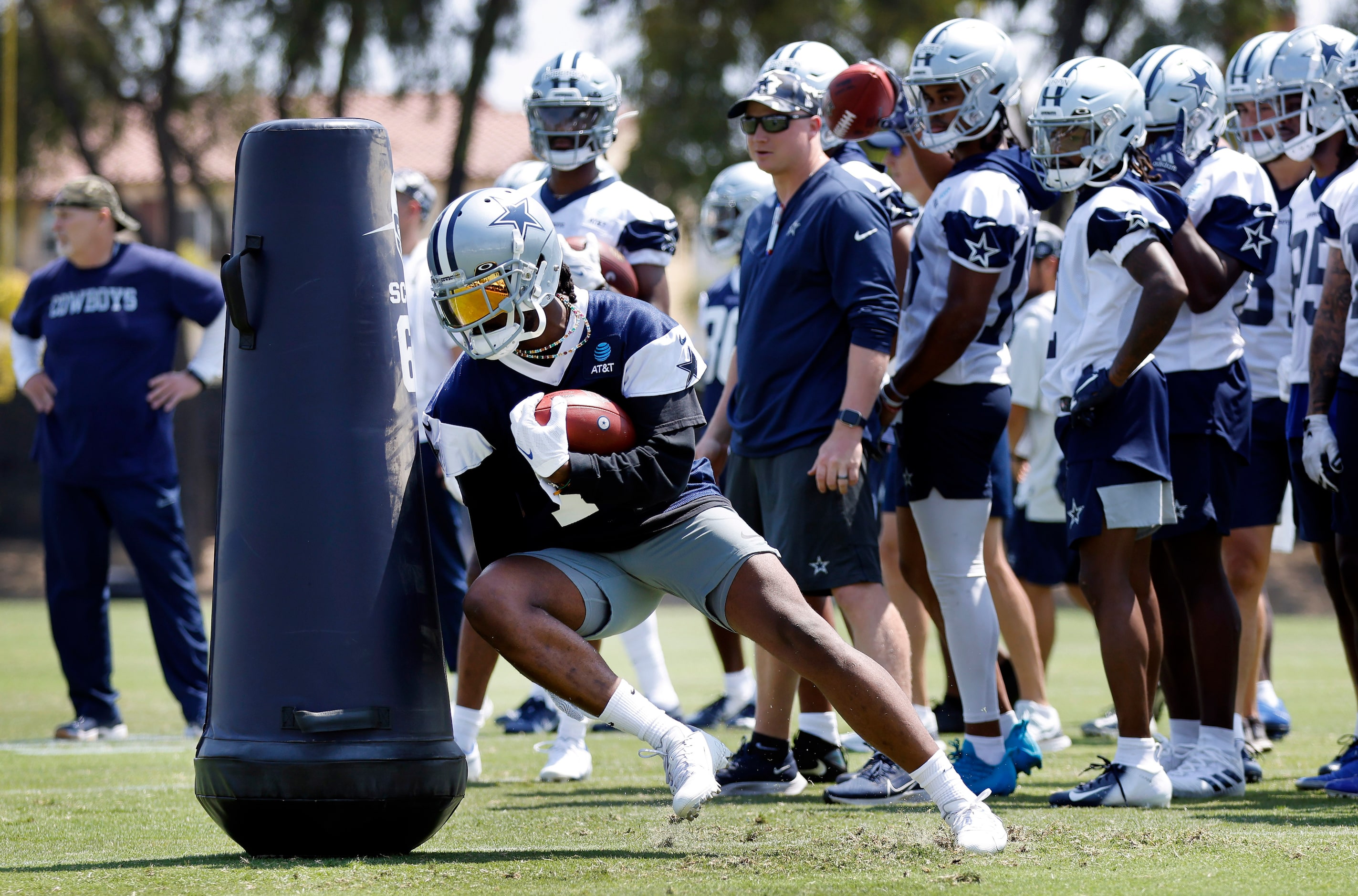 Dallas Cowboys cornerback Trevon Diggs (7) digs a turn around a blocking dummy as he carried...