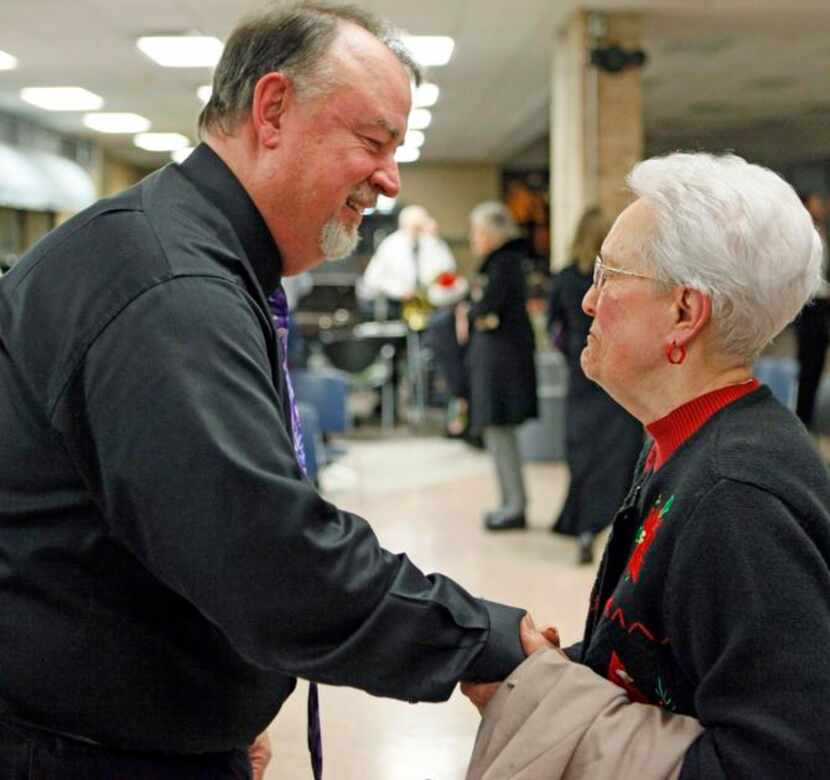
Jones meets with Jo Ellis, 84, after a holiday concert. The band performs four times each...