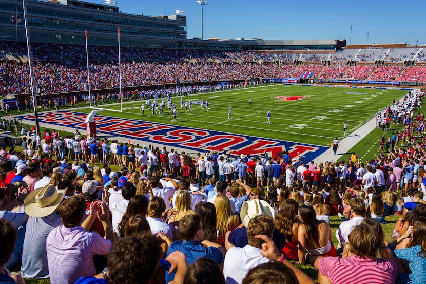 Fans watch during the first half of an NCAA football game between SMU and Temple at Ford...