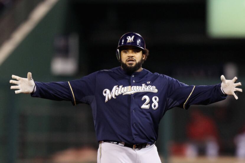 Prince Fielder of the Milwaukee Brewers gestures after he hit a double in the top of the...