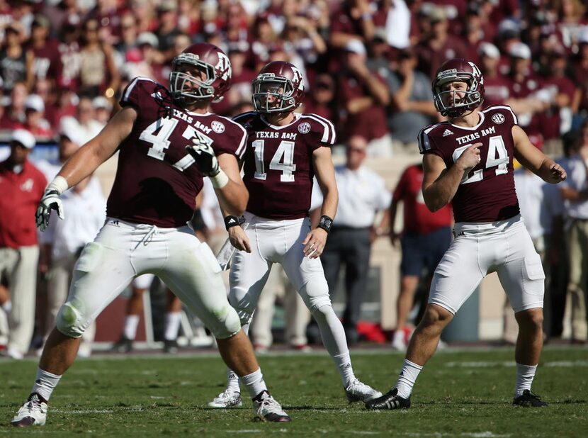 Texas A&M Aggies tight end Caden Smith (47), quarterback Conner McQueen (14) and place...