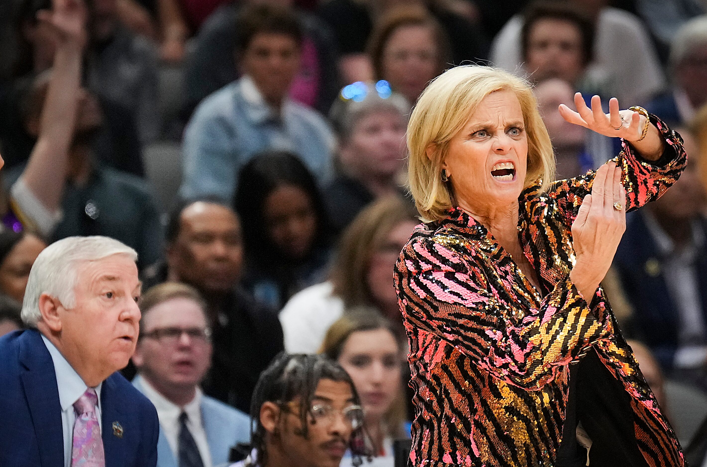 LSU head coach Kim Mulkey gestures as Iowa guard Caitlin Clark is assessed a technical foul...