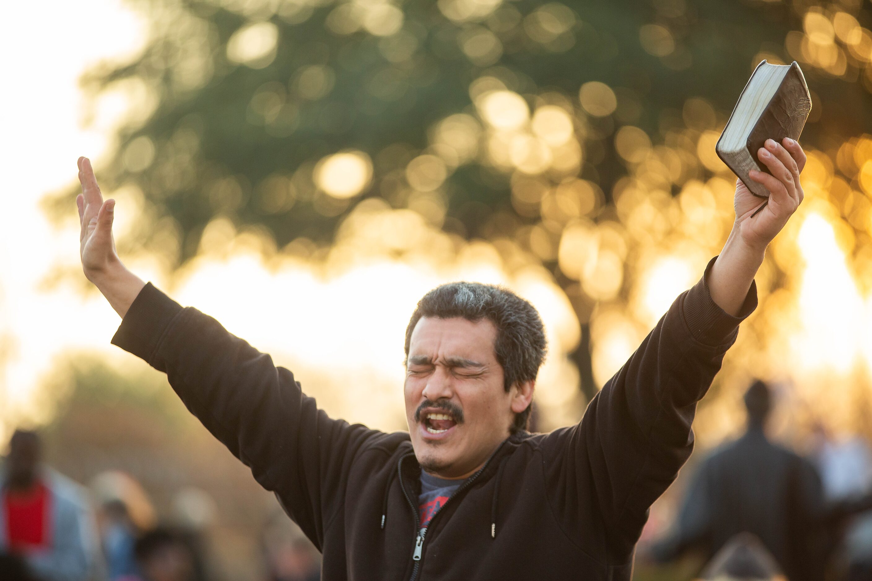 Carlos Pena sang along to worship music at S.O.U.L. Church in downtown Dallas on Dec. 8, 2019.