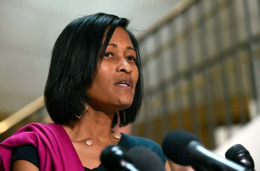 Cheryl Mills speaks to reporters on Capitol Hill in Washington. Senior staff members on...