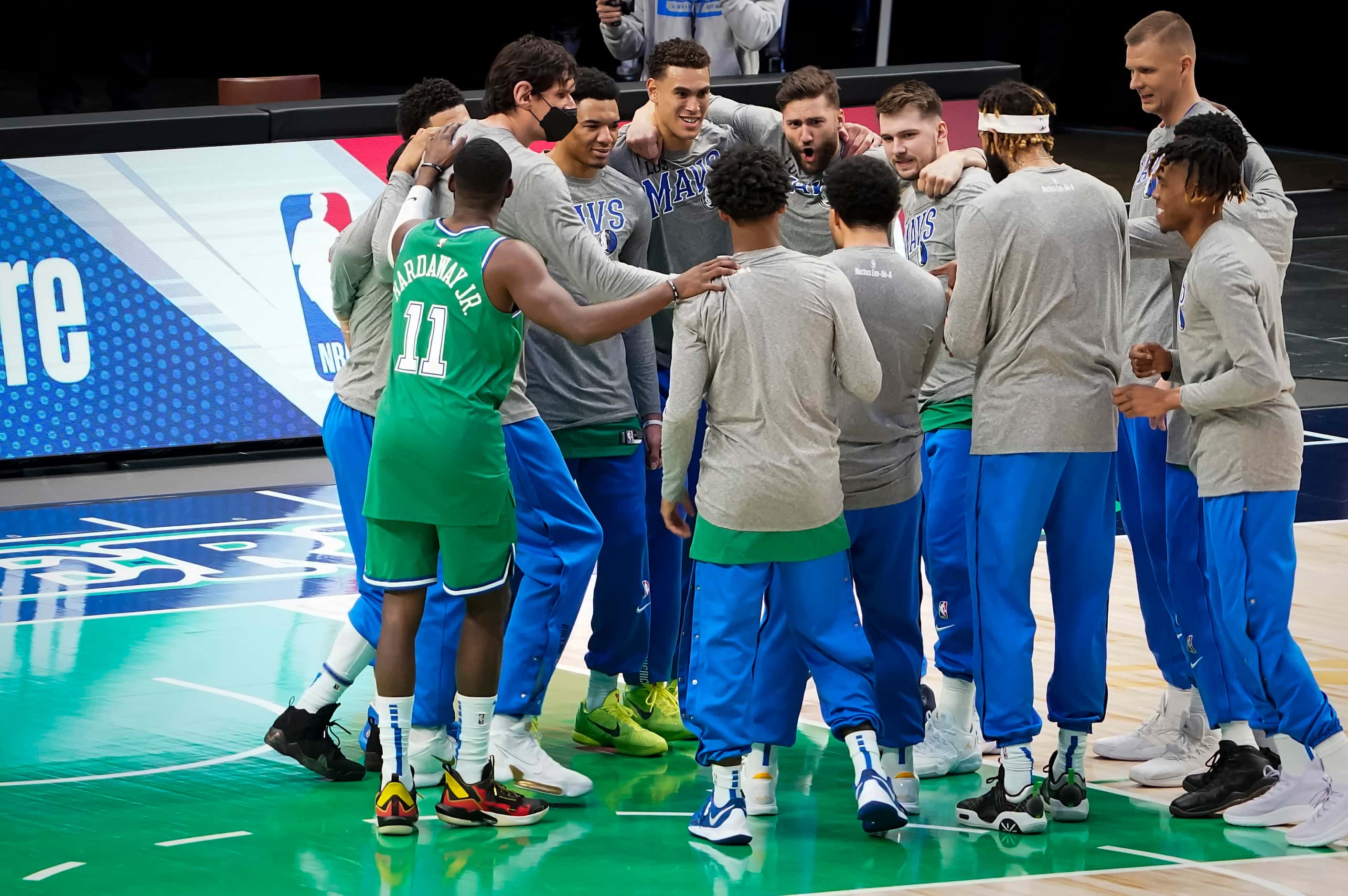 Dallas Mavericks players huddle before an NBA basketball game against the LA Clippers at...