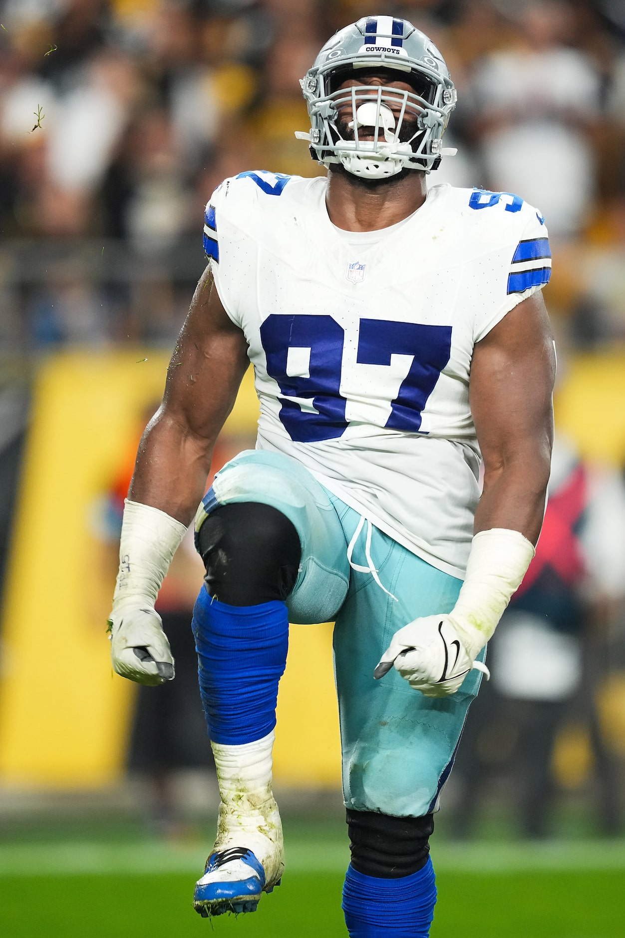 Dallas Cowboys defensive tackle Osa Odighizuwa (97) celebrates a sack of Pittsburgh Steelers...