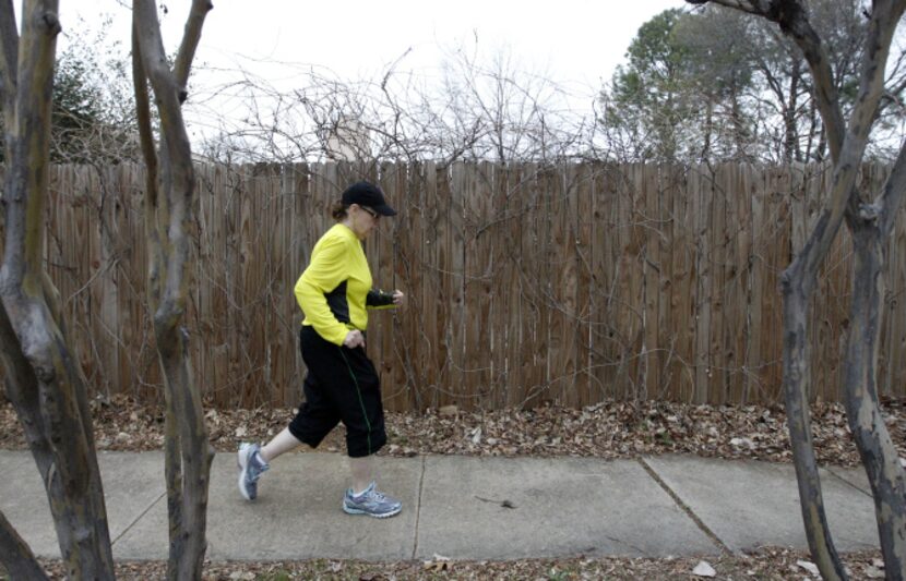 Lisa Taylor walks around her Flower Mound neighborhood for an exercising early morning on...