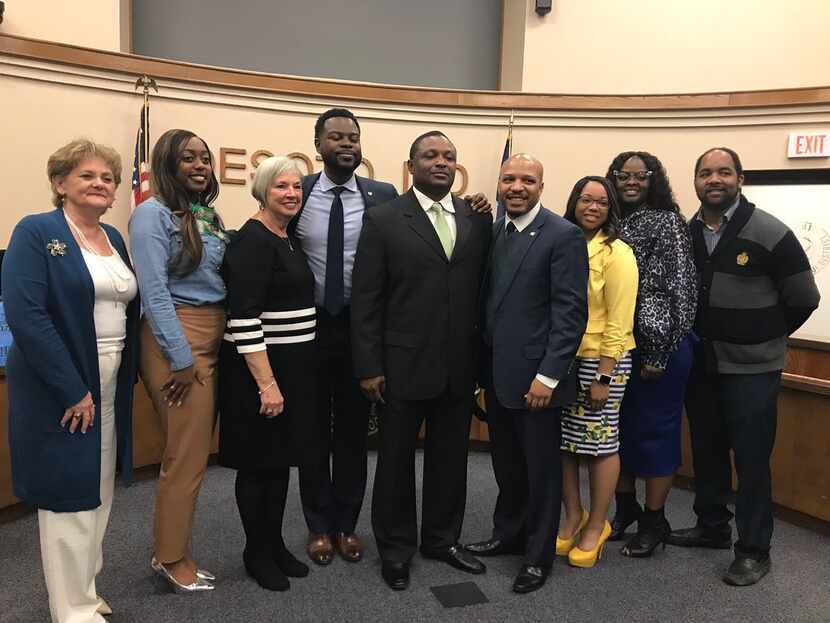 Claude Mathis (center with green tie) with the DeSoto school board.