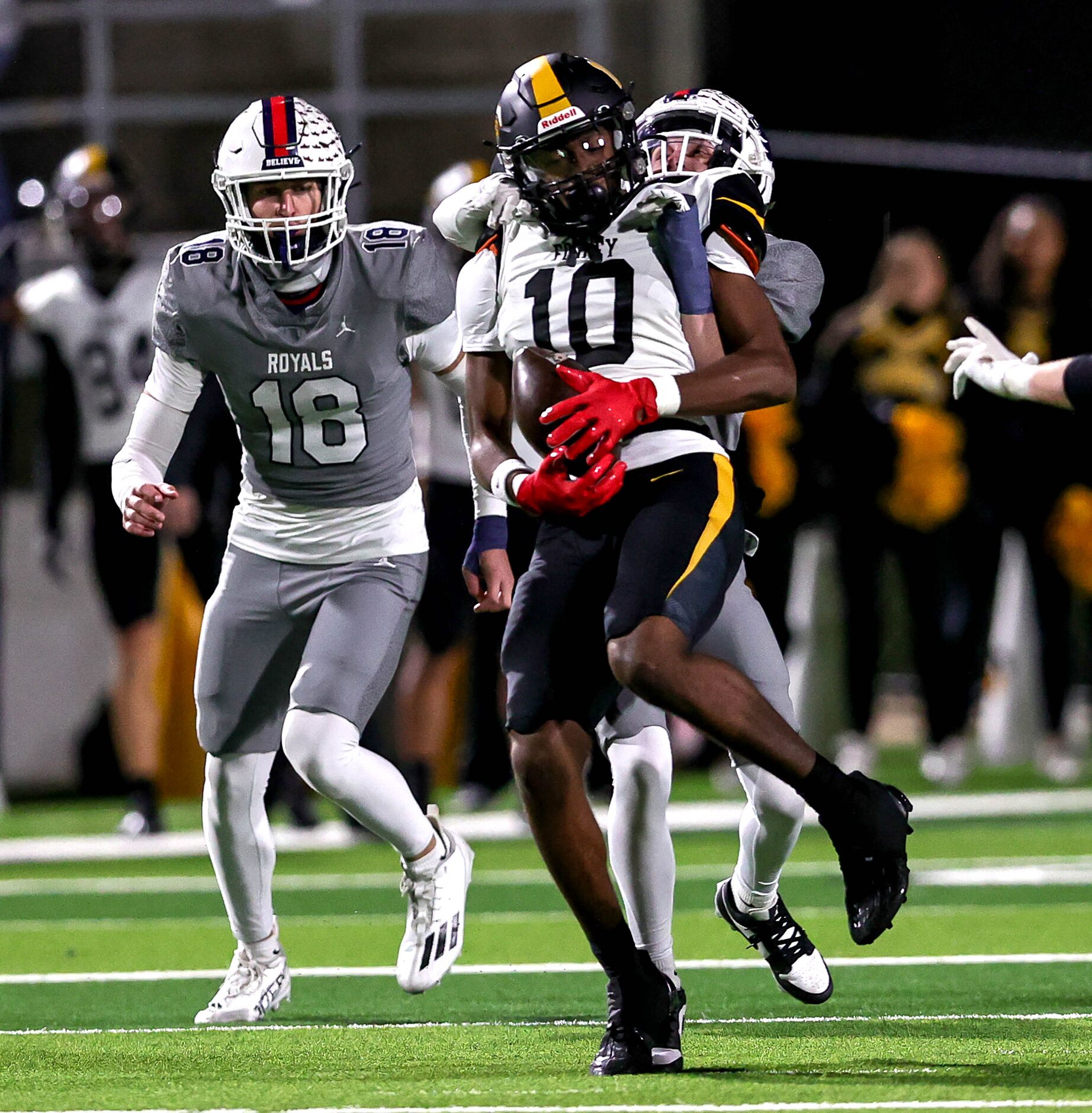 Forney wide receiver Kofi Eduful (10) comes down with a reception against Richland defensive...