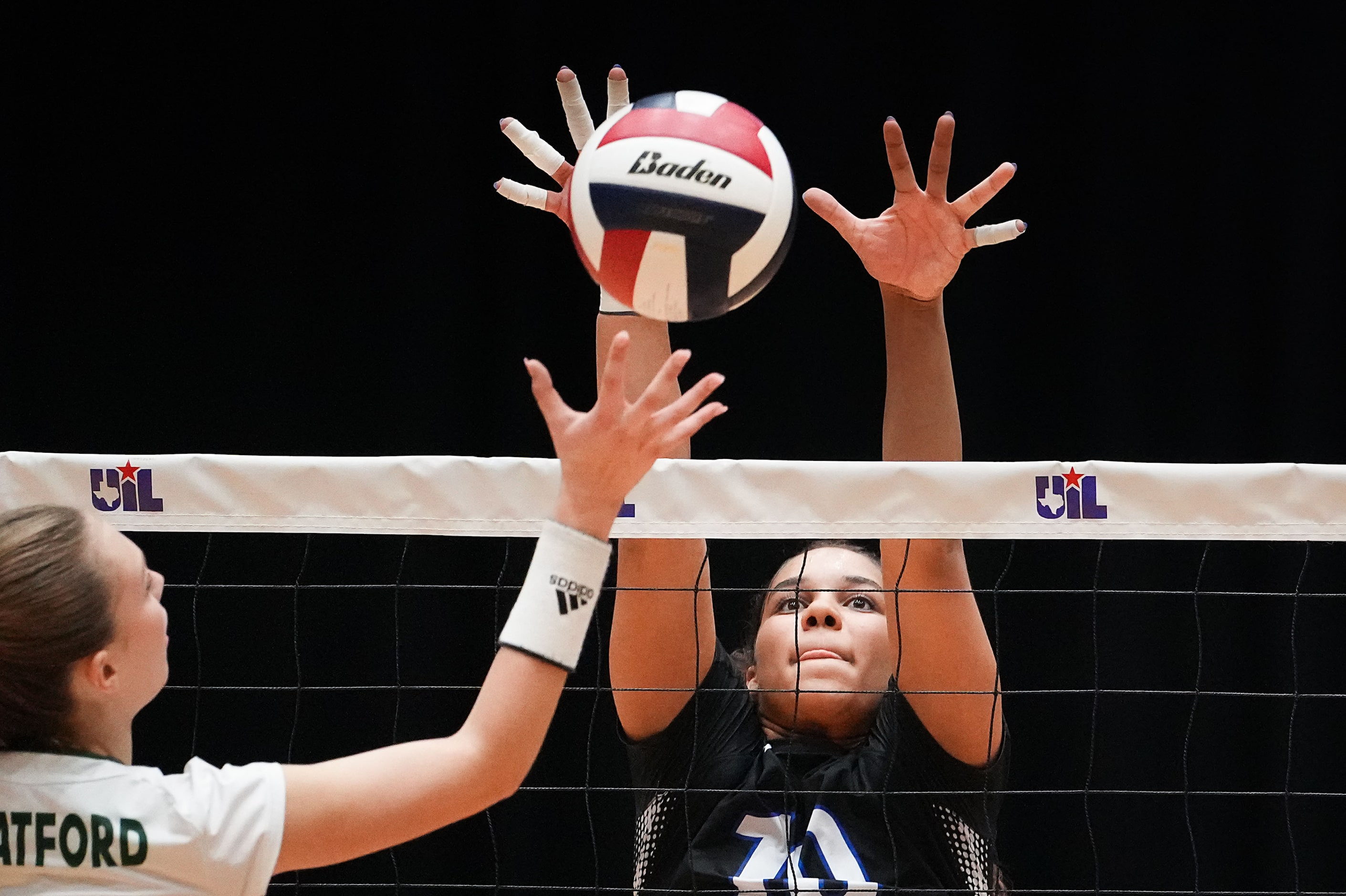 Trophy Club Byron Nelson's Sophee Peterson goes up for a block against Houston Stratford's...