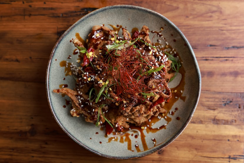 A plate of General Tso’s oyster mushrooms with tangy sweet sesame sauce at TLC Vegan Café in...