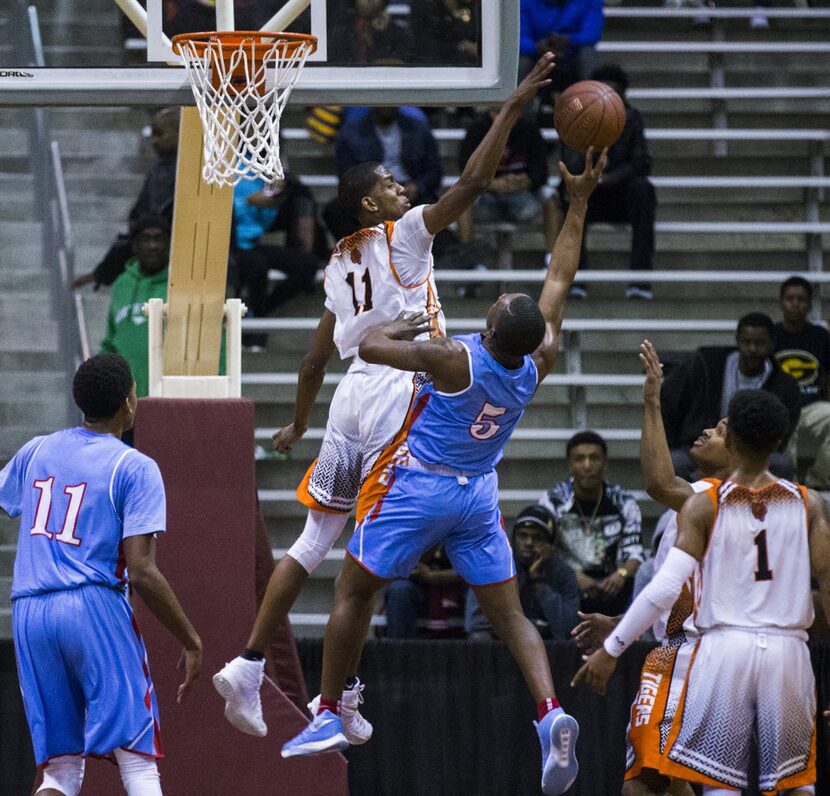 Lancaster's JaKolby Pemberton (11) blocks a shot by Skyline's Tivin Ridguard (5) during the...