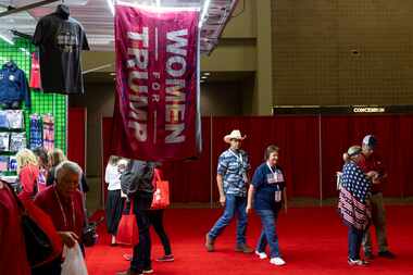 Delegates visit a booth selling Trump flags during the Texas GOP convention at Henry B....