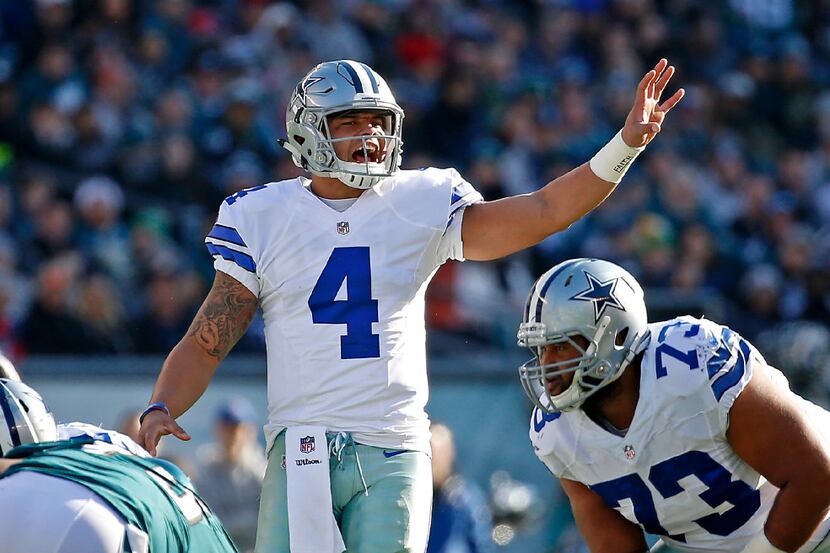 Dallas Cowboys quarterback Dak Prescott (4) yells at the line of a scrimmage against...