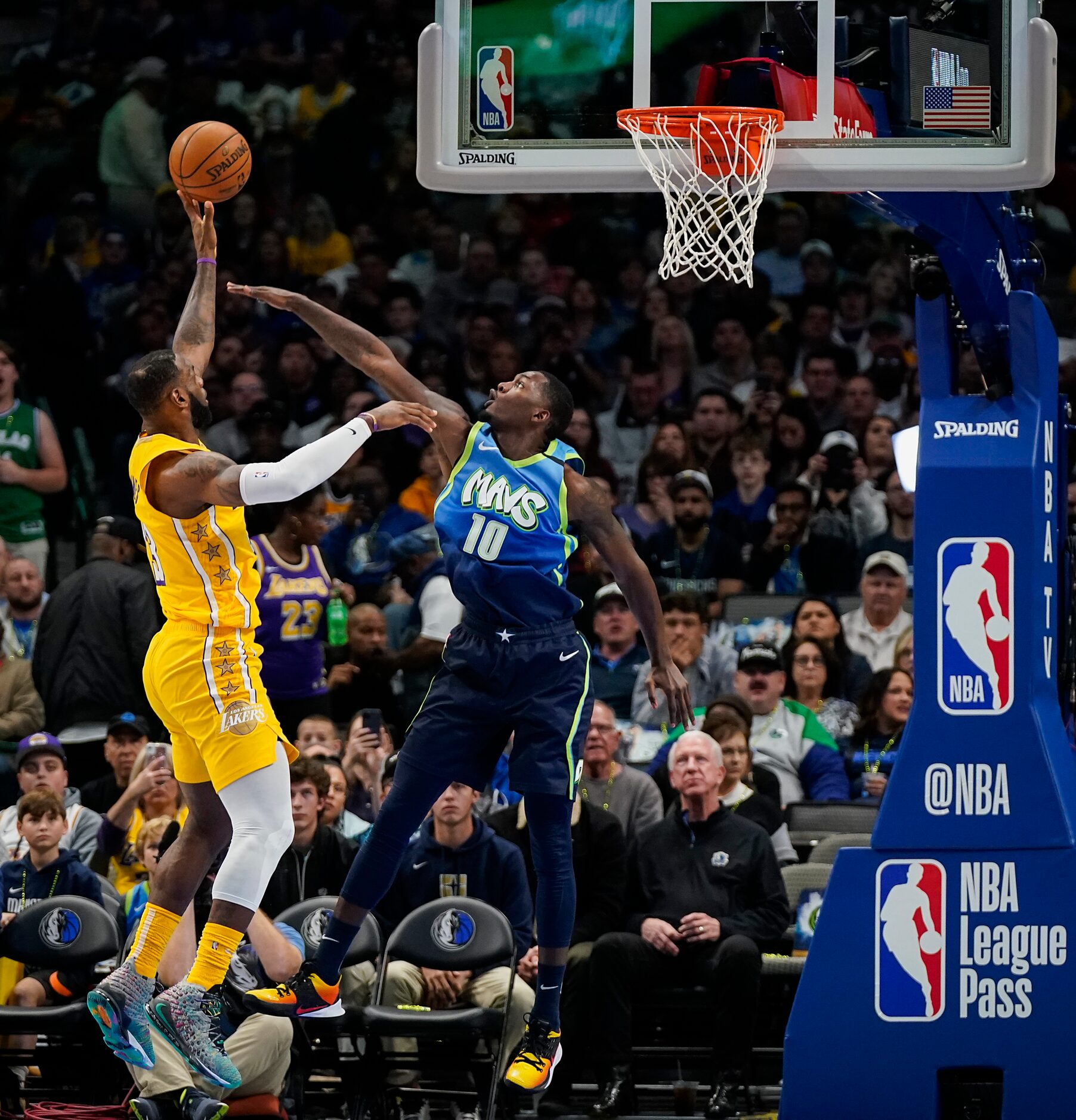 Los Angeles Lakers forward LeBron James (23) scores past Dallas Mavericks forward Dorian...