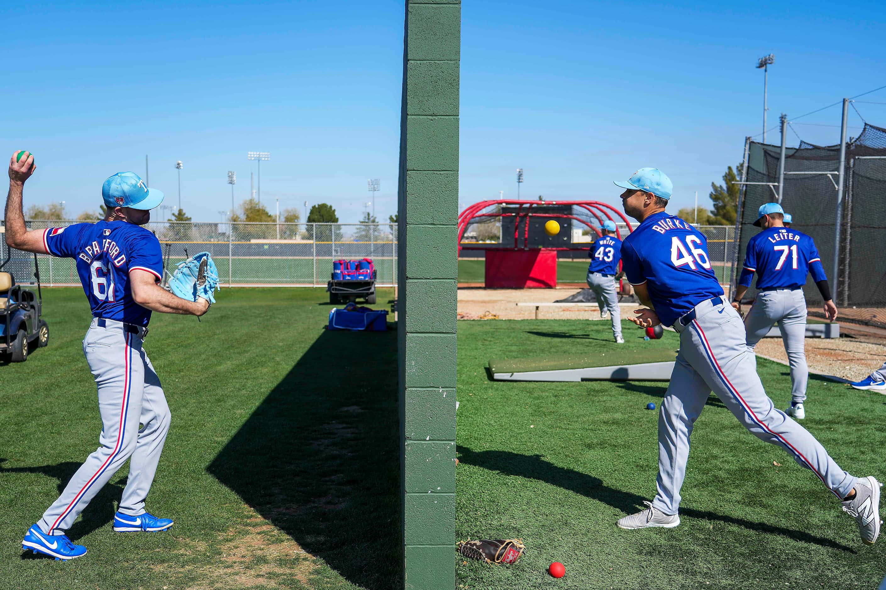 Texas Rangers pitchers Cody Bradford (61) and Brock Burke (46) toss weighted balls into...