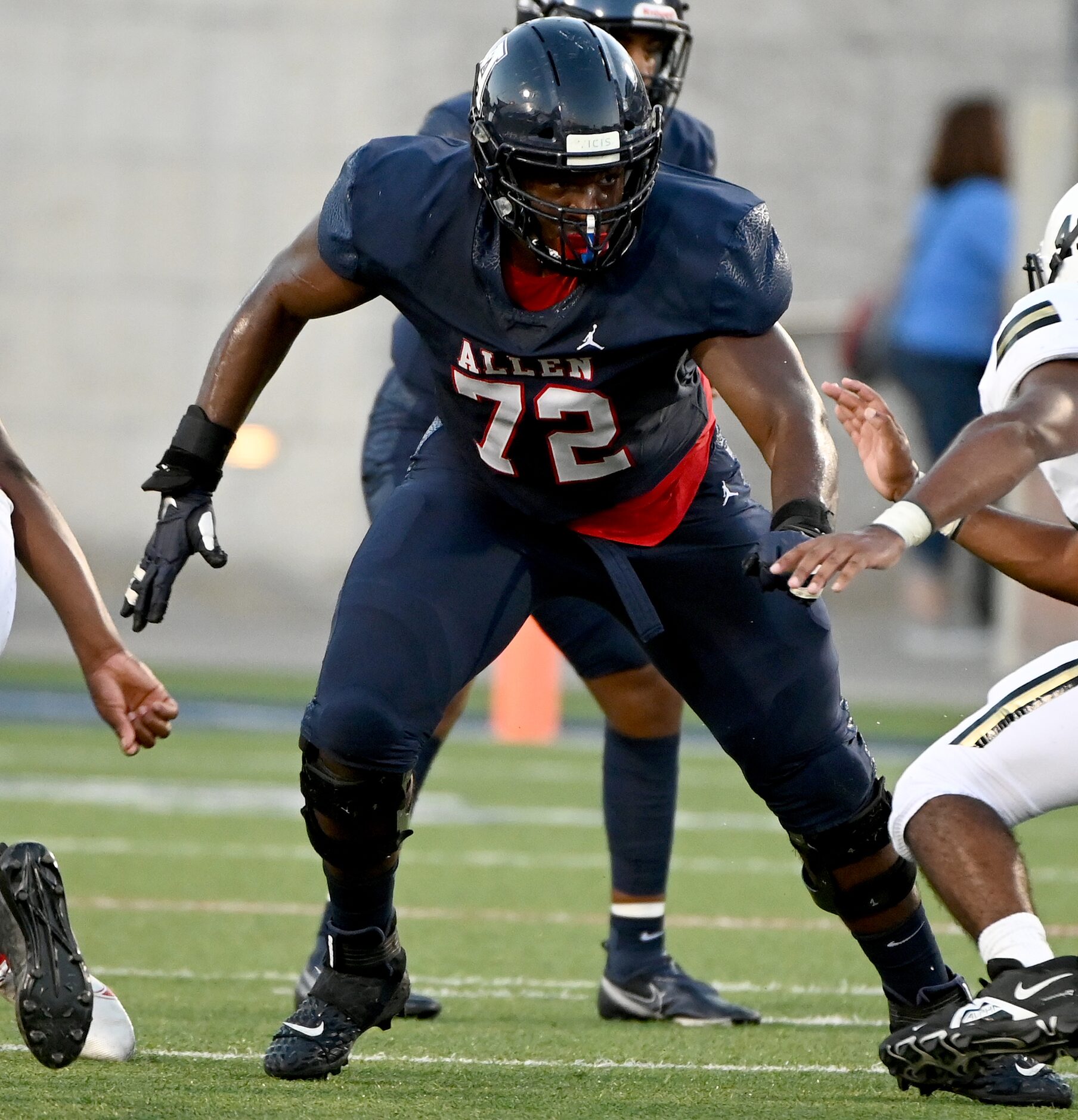 Allen’s Neto Umeozulu looks to make a block in the first half during a high school football...