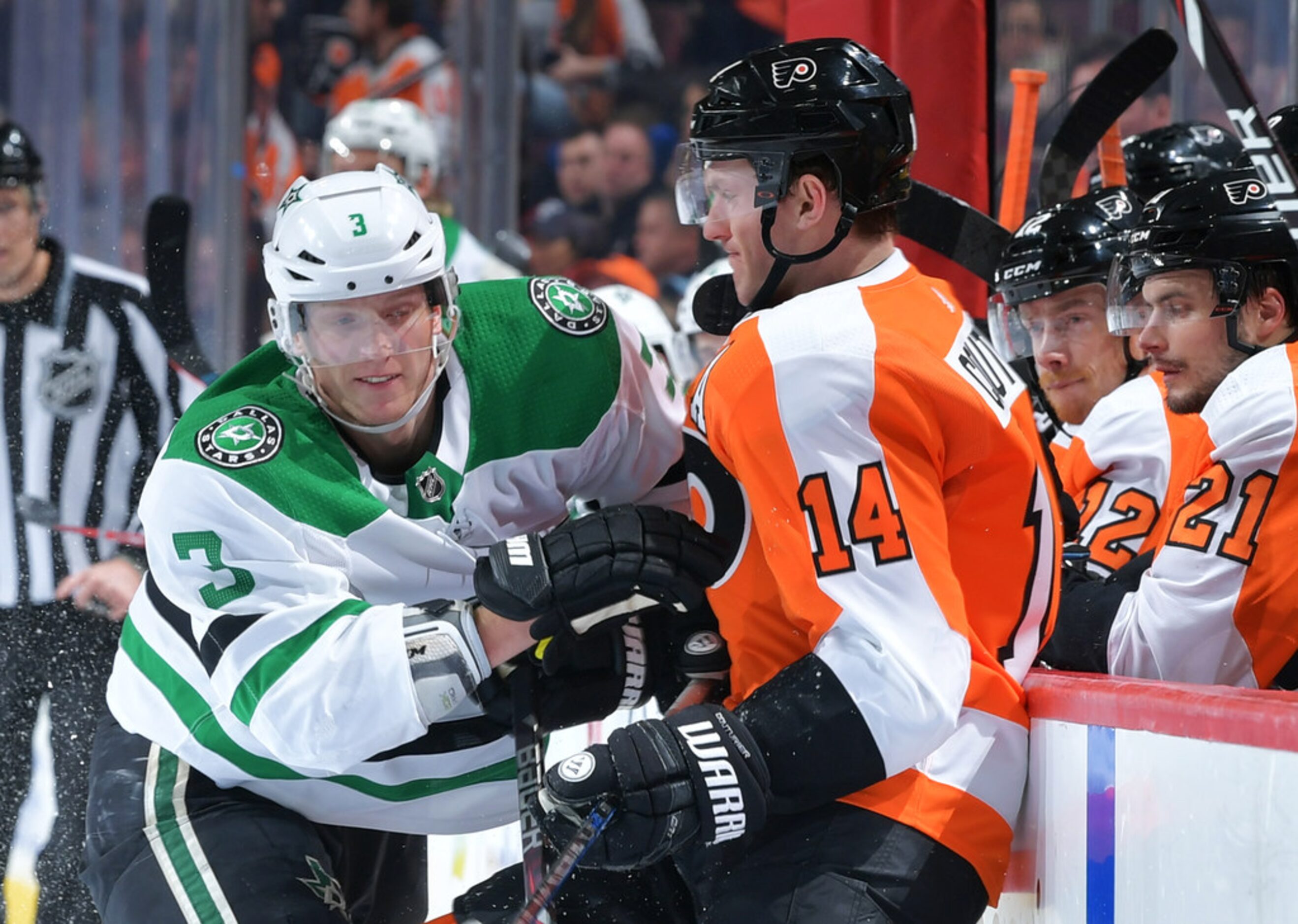 PHILADELPHIA, PENNSYLVANIA - JANUARY 10: John Klingberg #3 of the Dallas Stars checks Sean...