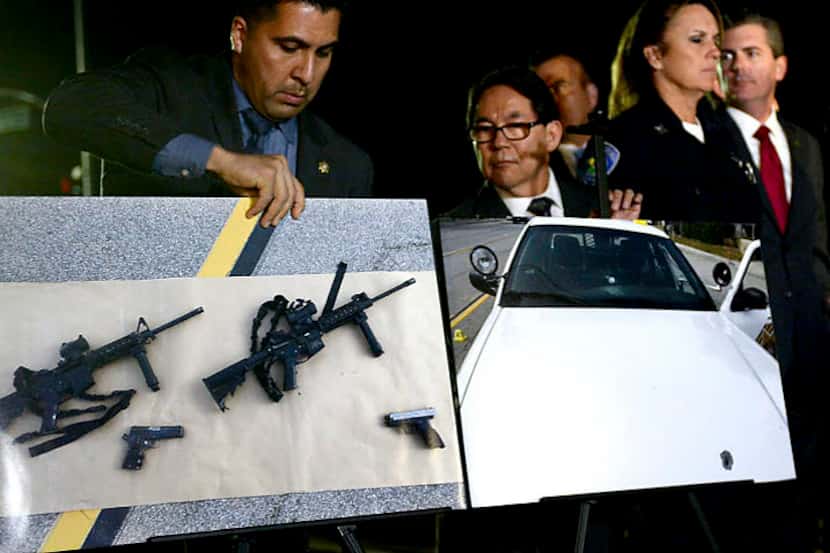  Photos of weapons used in the San Bernardino massacre are displayed at a news conference...