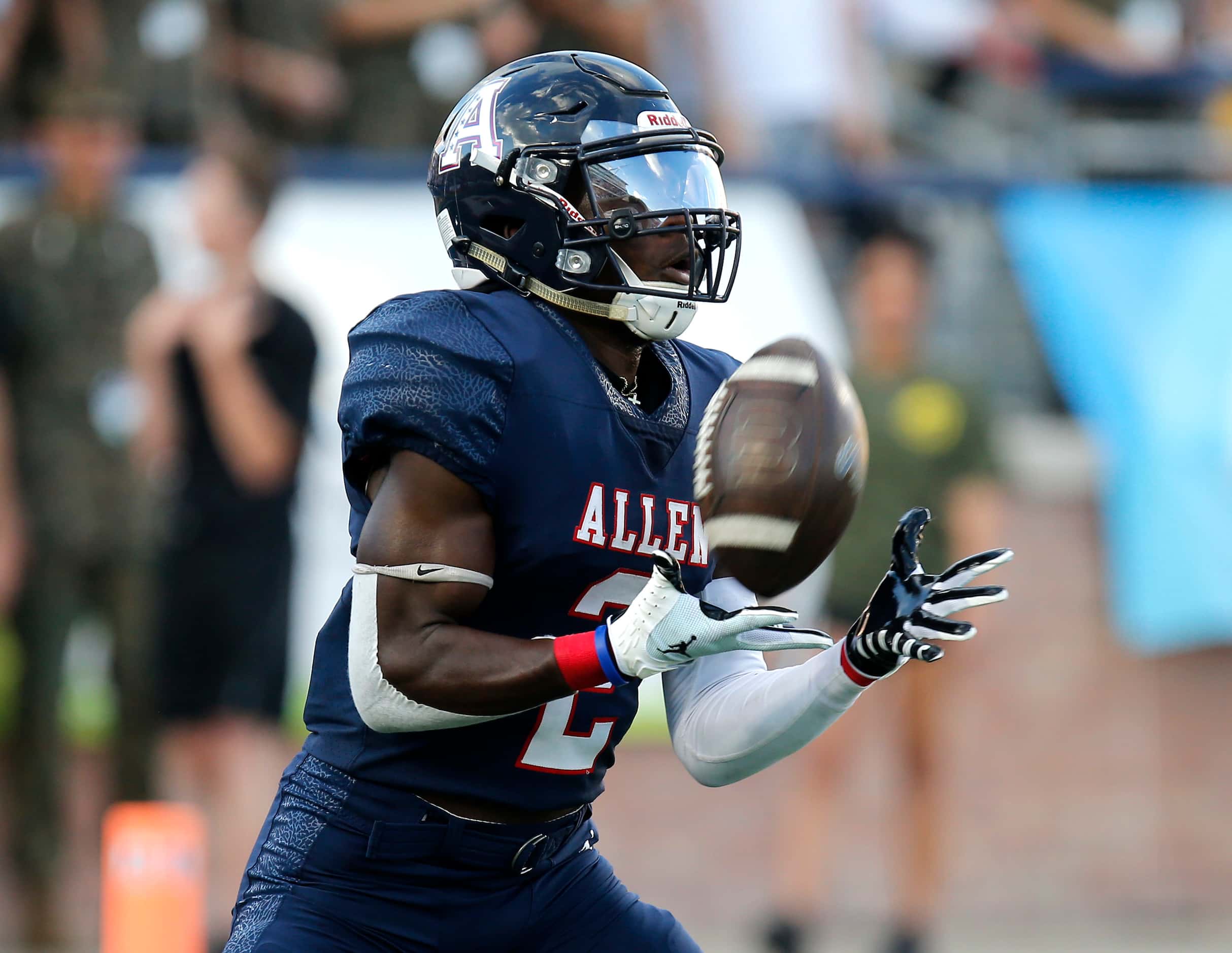 Allen High School kick returner Kayvion Sibley (2) catches the the opening kickoff during...