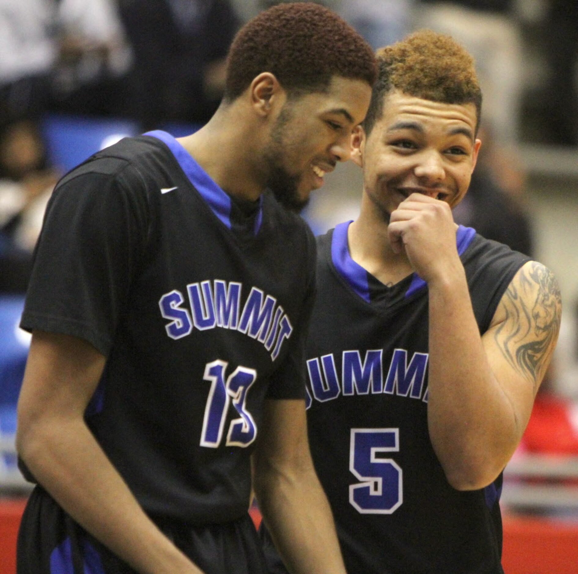 Mansfield Summit forward Keilyn Nance (5) and forward Terrance Hubby (13) share a brief...